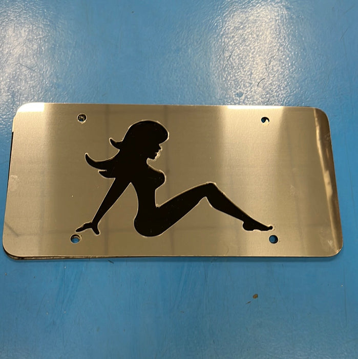 Mudflap Girl stainless steel license plate with black background