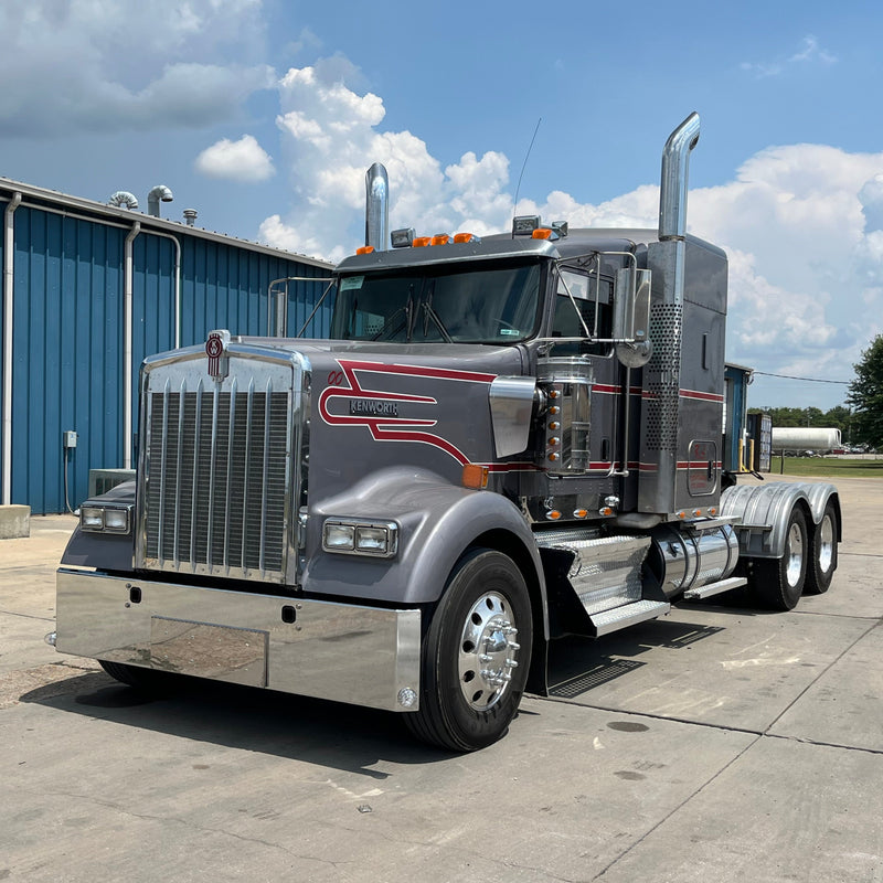Kenworth W900L chrome bumper with standard tow, center step, & mounting holes
