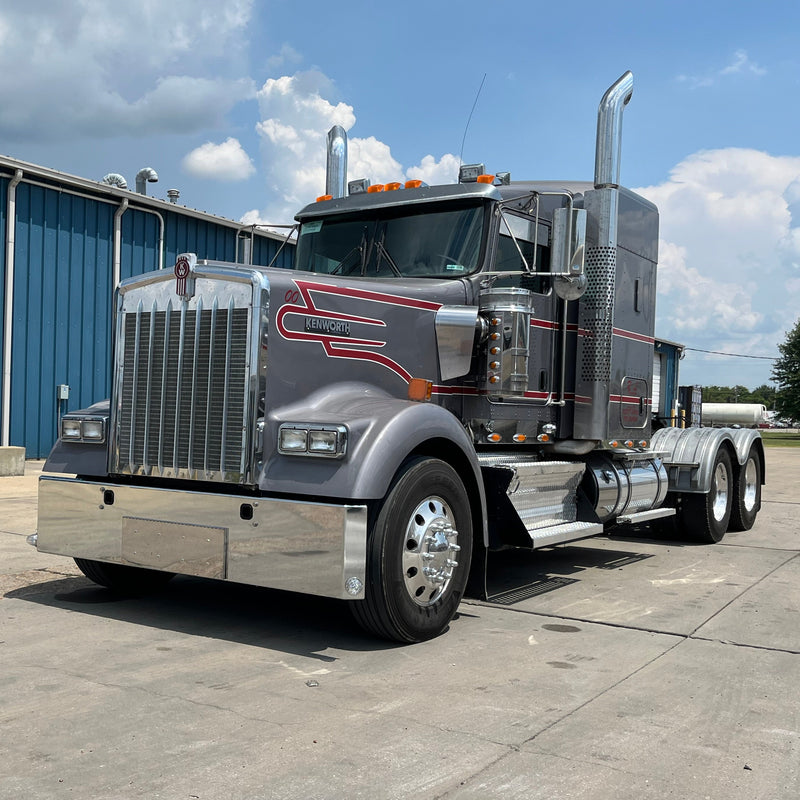 Kenworth W900L chrome bumper with standard tow, center step, & mounting holes