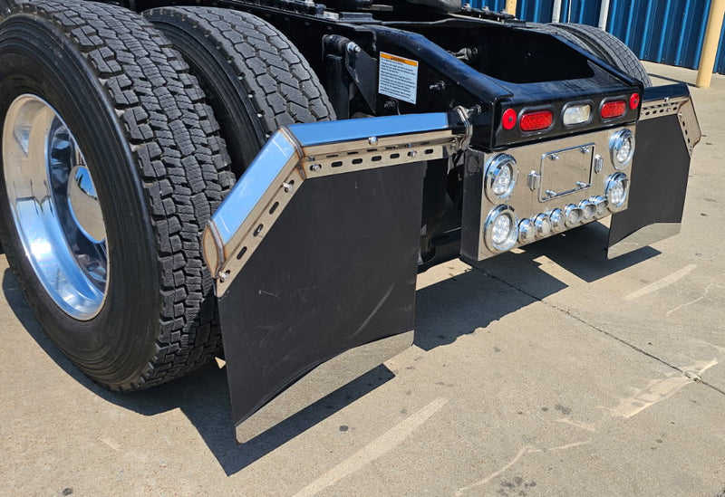 chrome mudflap hangers on rear frame of Mack truck