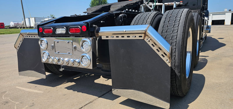 Chrome mudflap hangers and rear center panel on Mack truck