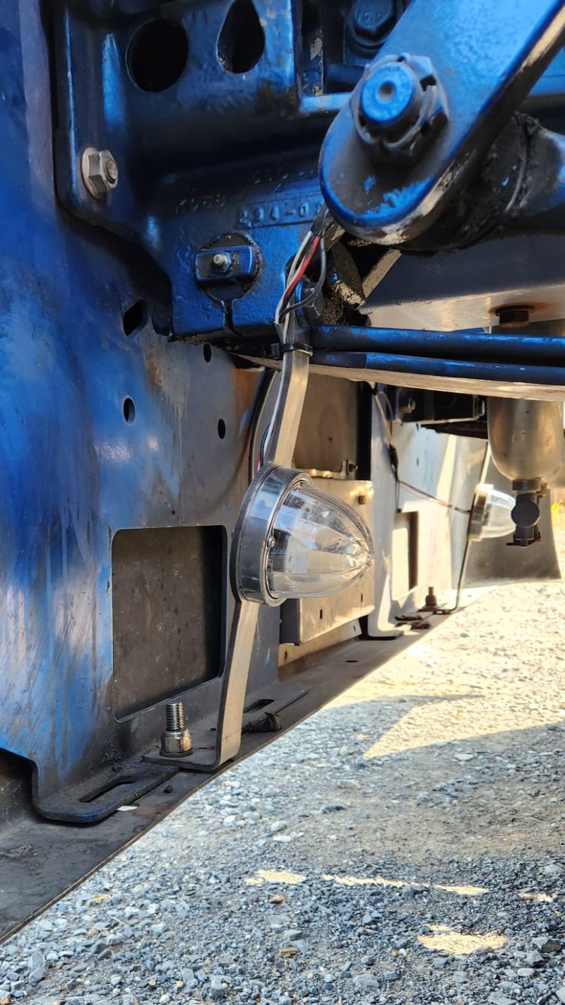 Kenworth W900 stainless steel lower support bracket with one watermelon light hole for 20" bumpers