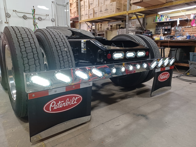 1 piece stainless steel rear mudflap hanger bar w/8 oval, 5 round 2" light holes